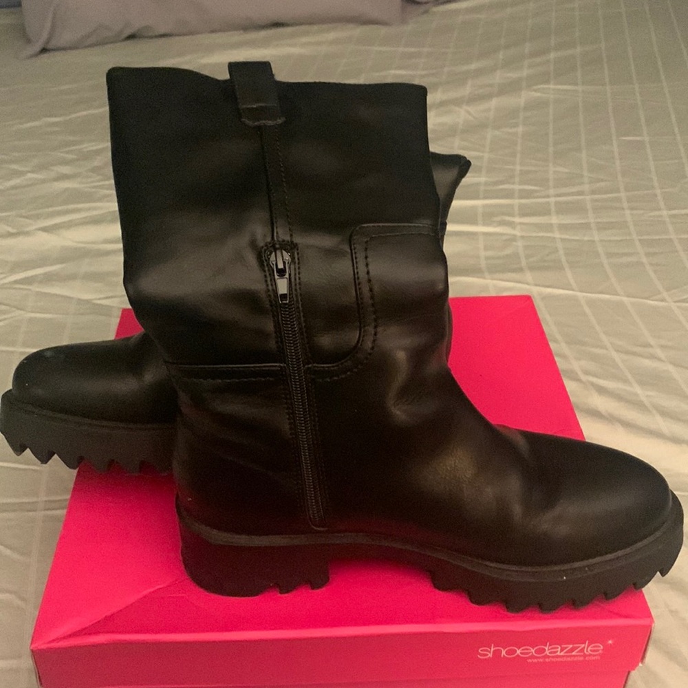 Black moto boots. Never worn.